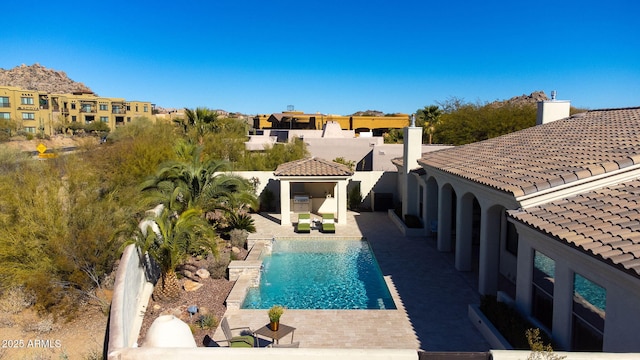 view of swimming pool with a patio area and a gazebo