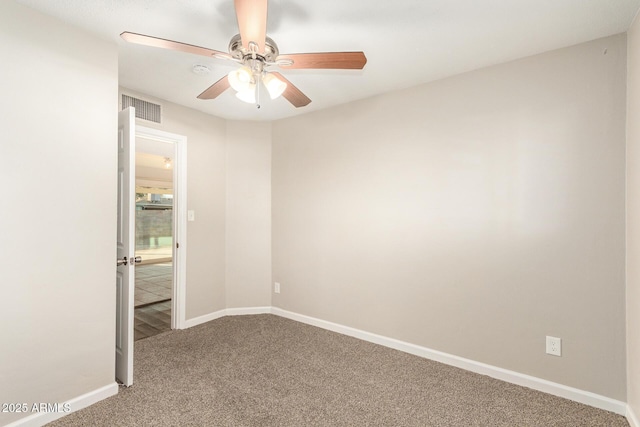 carpeted empty room with ceiling fan