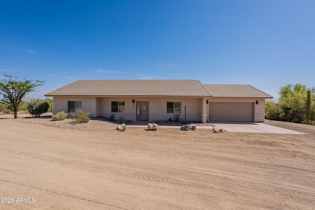 931 E Whiteley St, Apache Junction, AZ 85119 - single story home with concrete driveway, a tile roof, a garage, and stucco siding