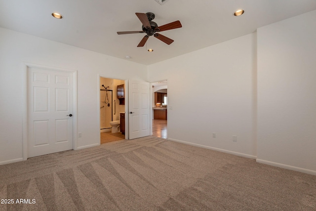 931 E Whiteley St, Apache Junction, AZ 85119 - unfurnished bedroom featuring carpet, ensuite bathroom, baseboards, recessed lighting, and arched walkways