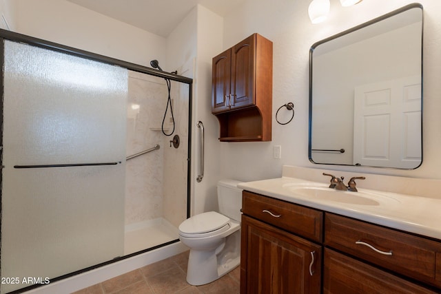 931 E Whiteley St, Apache Junction, AZ 85119 - bathroom featuring toilet, a shower stall, vanity, and tile patterned floors