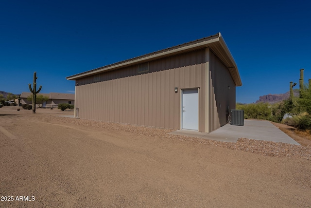 931 E Whiteley St, Apache Junction, AZ 85119 - view of outdoor structure featuring central AC unit and a mountain view