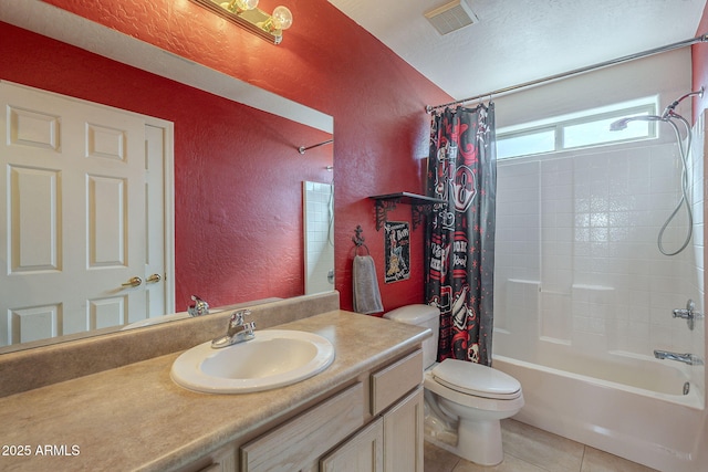 full bathroom featuring vanity, a textured ceiling, tile patterned floors, toilet, and shower / bath combo with shower curtain