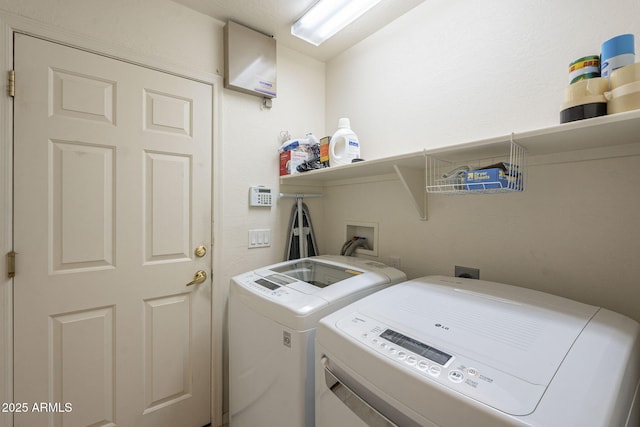 laundry room featuring independent washer and dryer