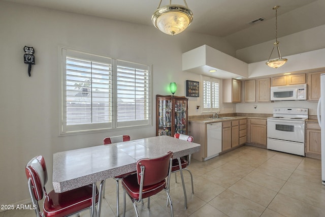 kitchen with pendant lighting, light tile patterned floors, white appliances, lofted ceiling, and light brown cabinets