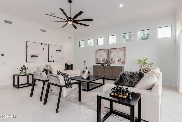 living room featuring visible vents, ceiling fan, baseboards, ornamental molding, and recessed lighting