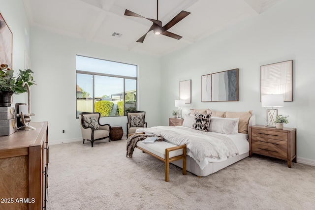 bedroom featuring ceiling fan, coffered ceiling, light colored carpet, and beam ceiling