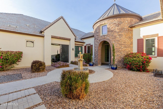 view of front of house featuring brick siding