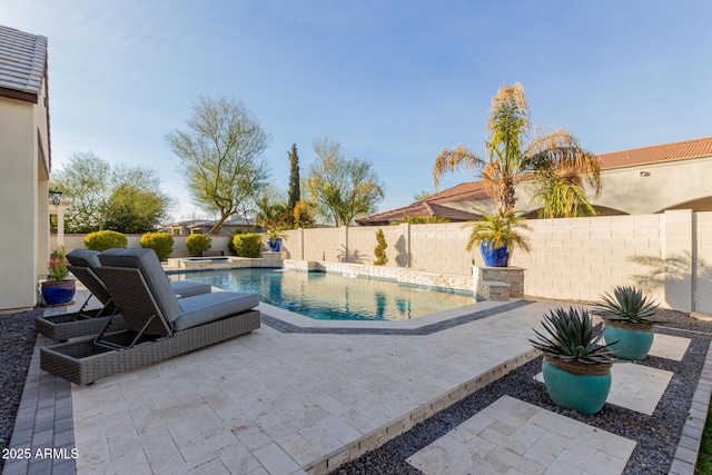 view of swimming pool with a patio area