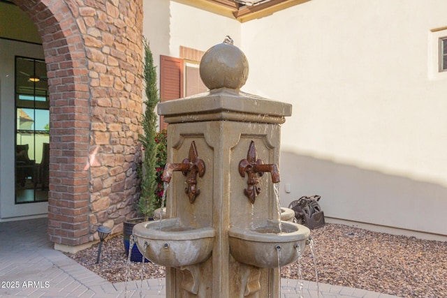 details with arched walkways and stucco siding