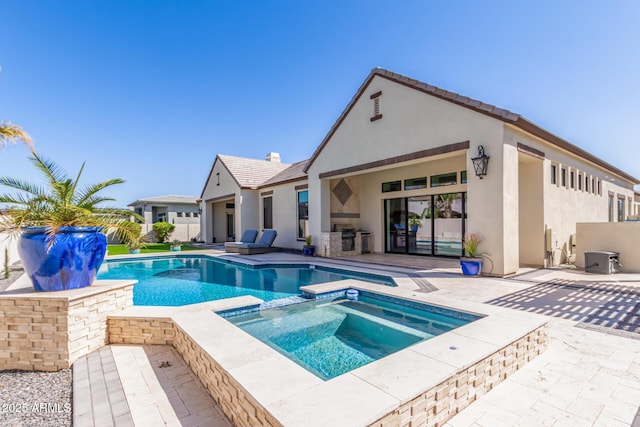 view of pool with fence, a pool with connected hot tub, and a patio area