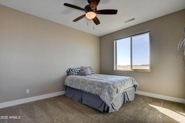 carpeted bedroom featuring visible vents, ceiling fan, and baseboards