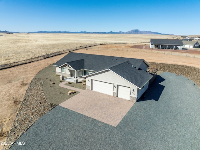 birds eye view of property featuring a mountain view