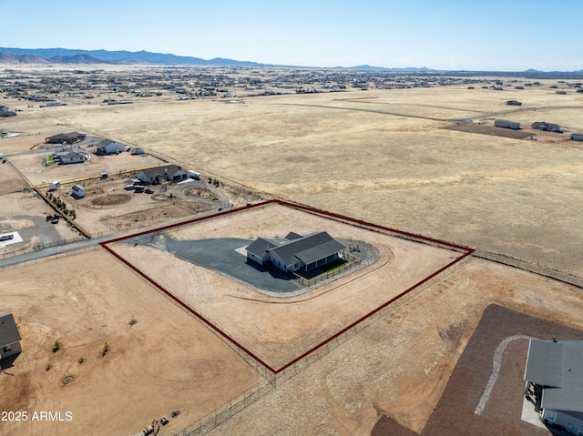 birds eye view of property featuring a rural view and a mountain view