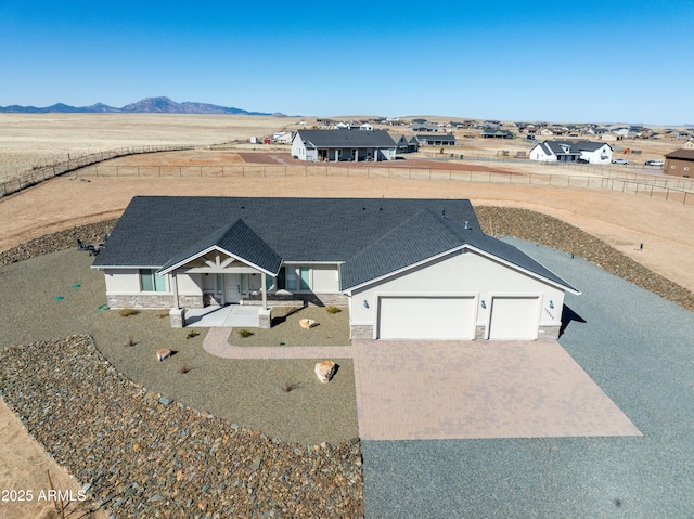 drone / aerial view featuring a mountain view