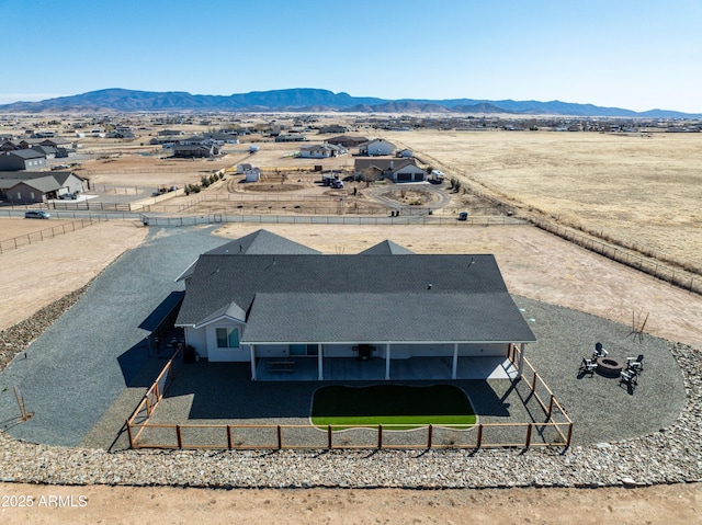 birds eye view of property with a mountain view