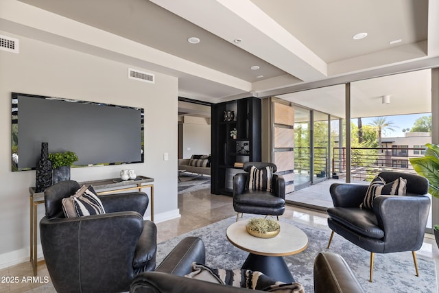 living room with floor to ceiling windows