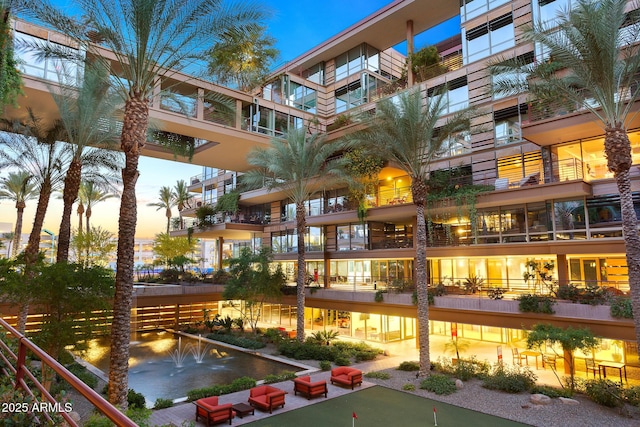 view of outdoor building at dusk