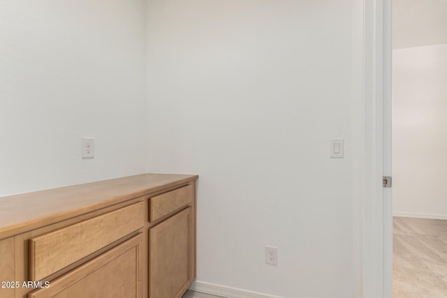 interior space featuring baseboards