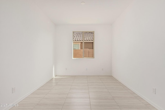 empty room with baseboards