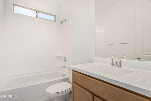 bathroom featuring vanity, bathing tub / shower combination, and toilet