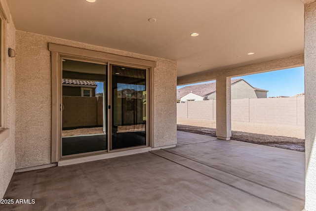 view of patio / terrace featuring fence