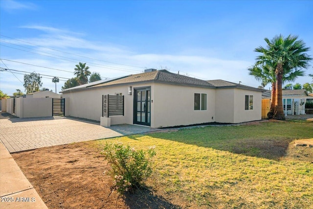 4400 N 20th St, Phoenix, AZ 85016 - rear view of house featuring stucco siding, a patio area, and french doors