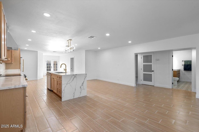 4400 N 20th St, Phoenix, AZ 85016 - kitchen with wall chimney exhaust hood, recessed lighting, open floor plan, an island with sink, and light wood-type flooring