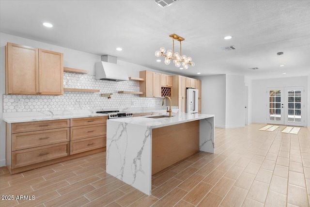 4400 N 20th St, Phoenix, AZ 85016 - kitchen featuring custom exhaust hood, open shelves, backsplash, light brown cabinets, and recessed lighting