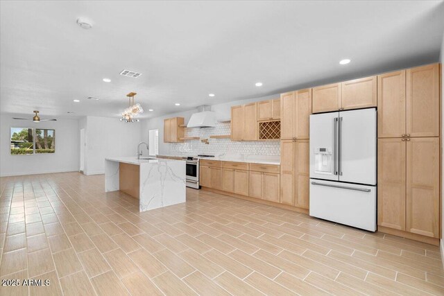 4400 N 20th St, Phoenix, AZ 85016 - kitchen with high end white refrigerator, stainless steel range oven, light brown cabinets, backsplash, and recessed lighting