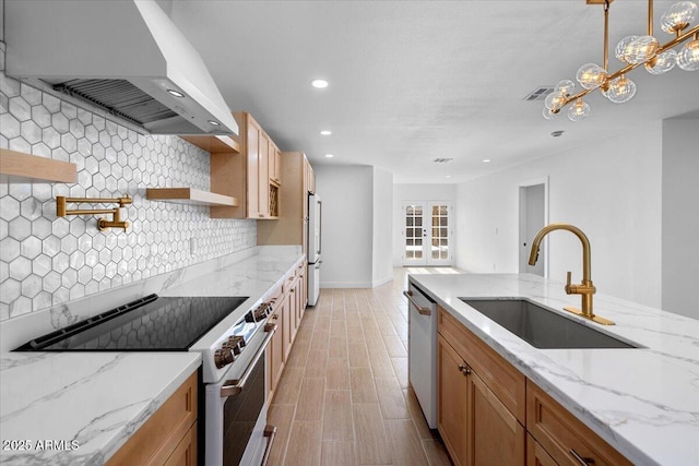 4400 N 20th St, Phoenix, AZ 85016 - kitchen with electric stove, wall chimney range hood, white dishwasher, decorative backsplash, and recessed lighting