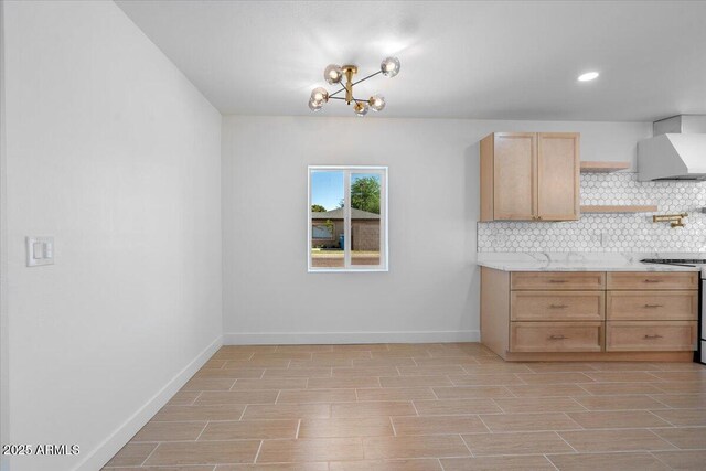 4400 N 20th St, Phoenix, AZ 85016 - kitchen featuring gas range, backsplash, light brown cabinetry, light wood-type flooring, and a chandelier