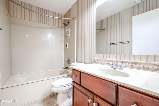 full bathroom with vanity, toilet, tile patterned floors, and bathing tub / shower combination