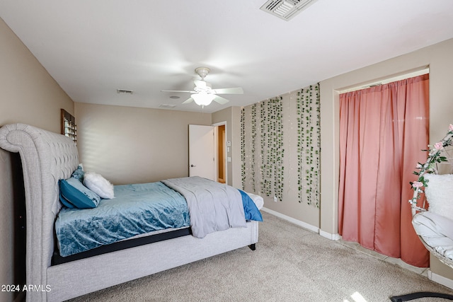 bedroom with ceiling fan and carpet