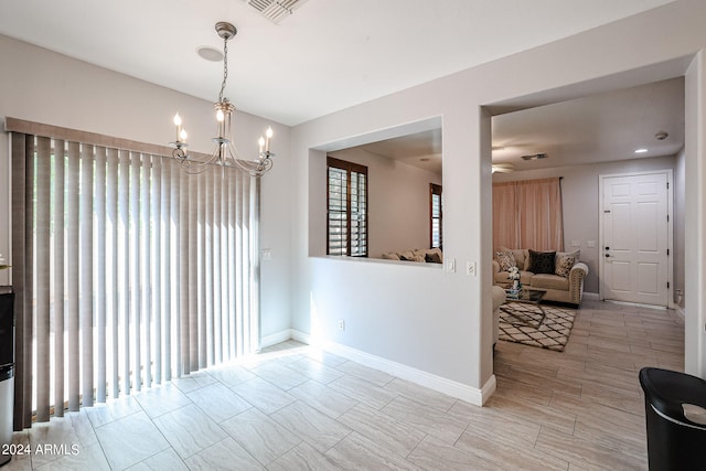 dining space with a healthy amount of sunlight and a chandelier