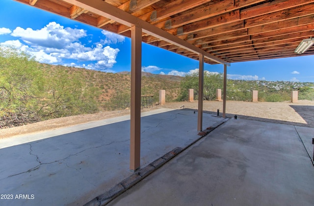 view of patio / terrace with a mountain view