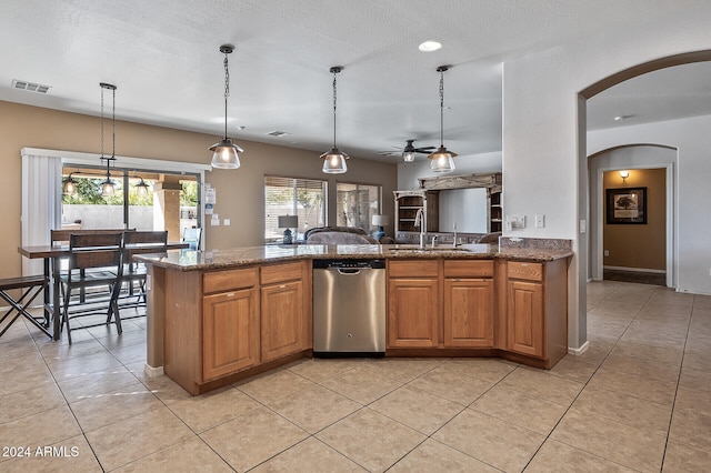 kitchen with ceiling fan, dishwasher, light tile patterned flooring, pendant lighting, and sink