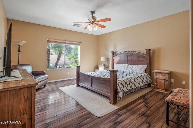 bedroom featuring ceiling fan and dark hardwood / wood-style flooring