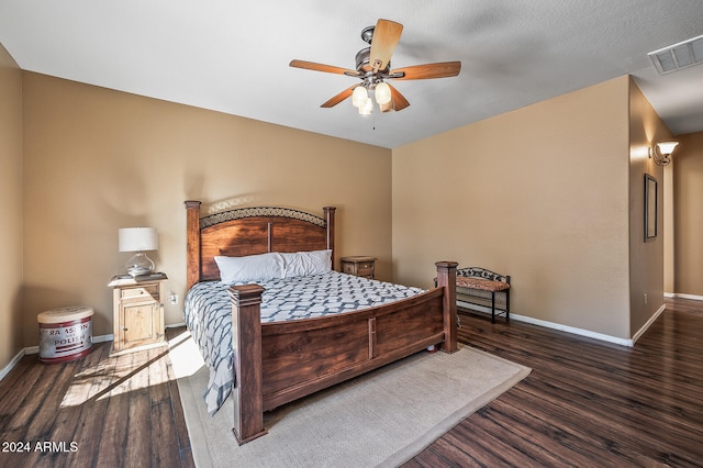 bedroom with dark wood-type flooring and ceiling fan