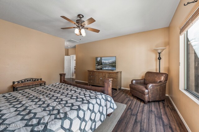 bedroom featuring dark hardwood / wood-style flooring and ceiling fan