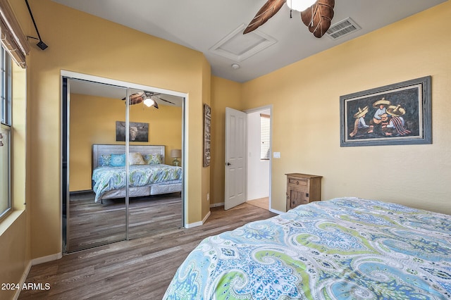 bedroom with a closet, ceiling fan, and hardwood / wood-style flooring