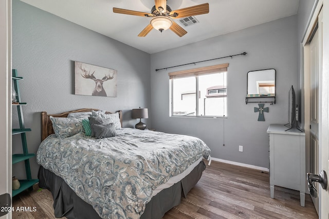 bedroom featuring hardwood / wood-style flooring and ceiling fan