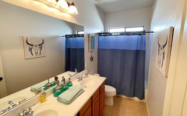 full bathroom with toilet, shower / bath combo with shower curtain, vanity, and tile patterned flooring