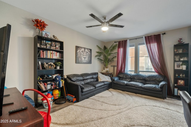 living room with hardwood / wood-style flooring and ceiling fan