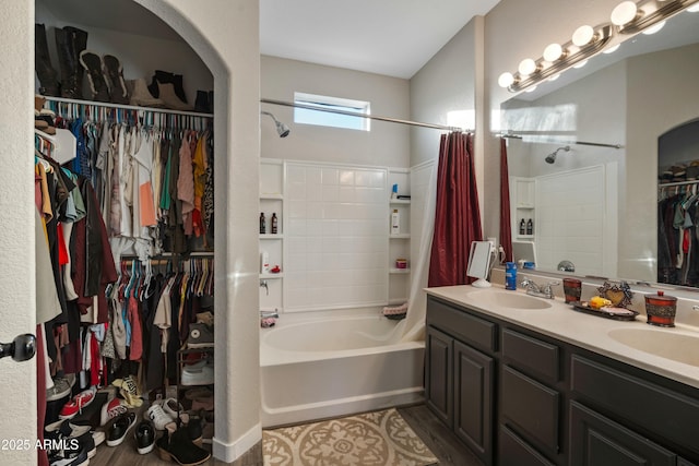 bathroom with vanity, wood-type flooring, and shower / bath combination with curtain