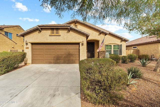 mediterranean / spanish-style house featuring a garage