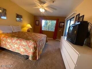 carpeted bedroom with a ceiling fan