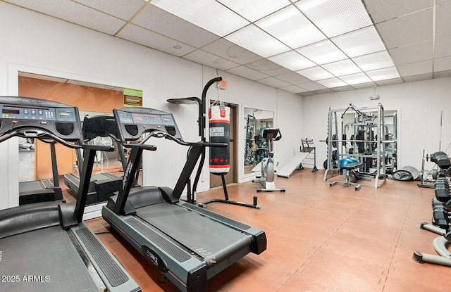 workout area with a paneled ceiling