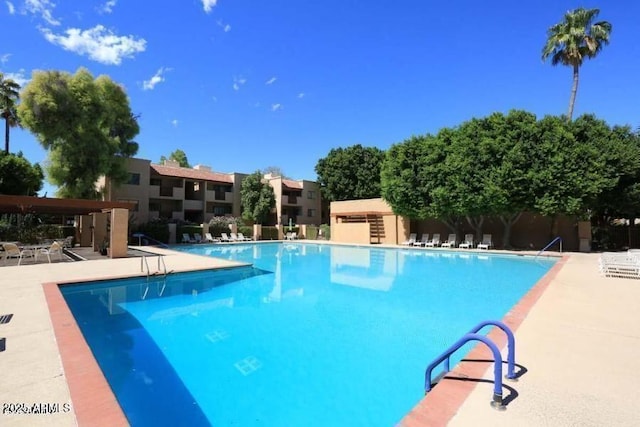 pool with a patio area