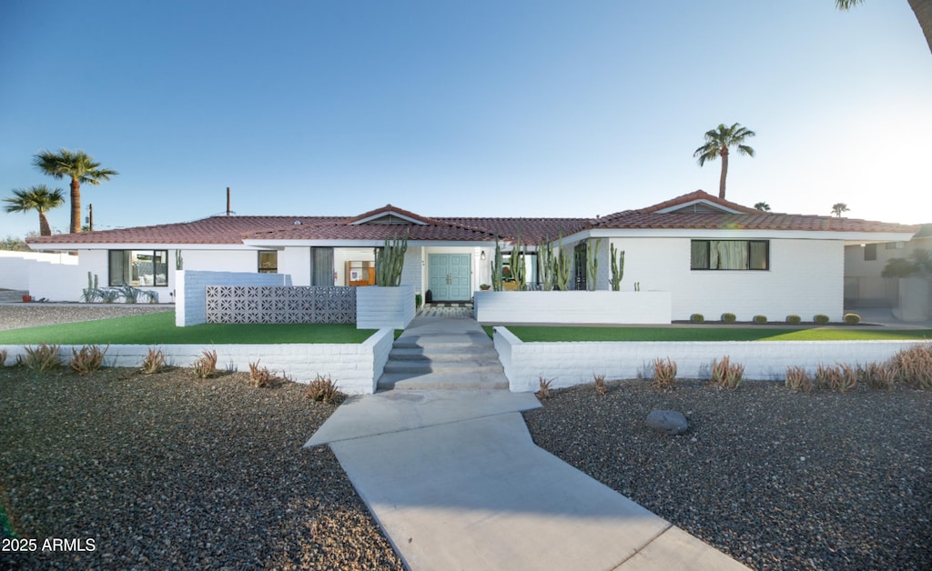 view of front of home featuring a tiled roof